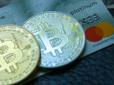 Bitcoin fanboys rally as prices tank
